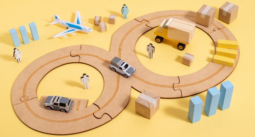 A miniature train track with various cars and trucks, representing the idea of 'Navigating Transport Costs'.